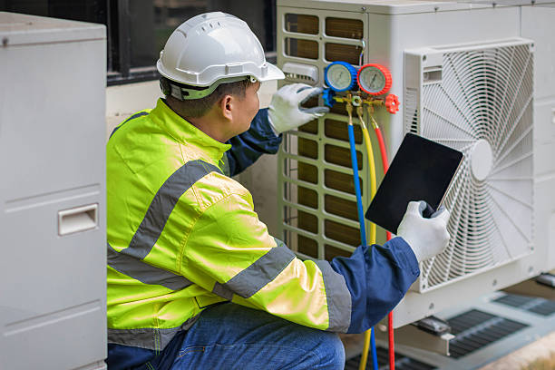 Professional Air Duct Cleaning technician working in Lake in the Hills, IL